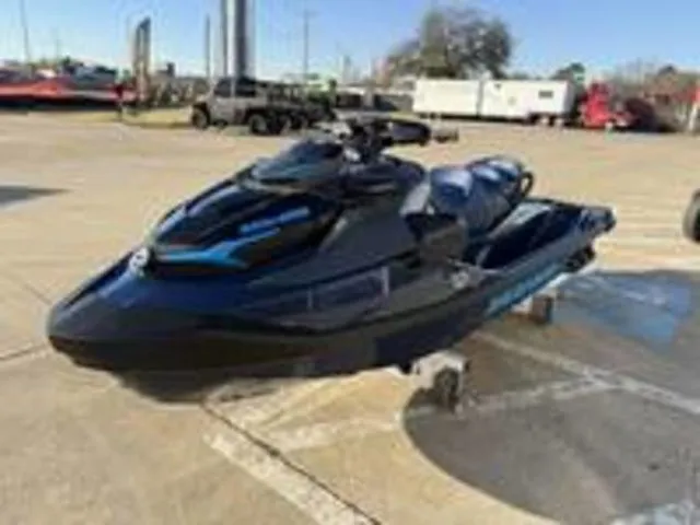 Slide: The Image of 2026 Sea-Doo GTX 230 jet ski in parking lot, black and blue design. - 3