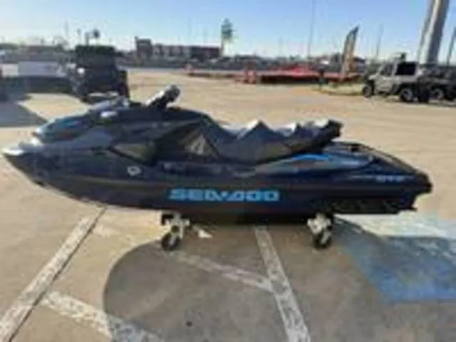 Slide: The Image of 2026 Sea-Doo GTX 230 jet ski displayed in parking lot. - 4