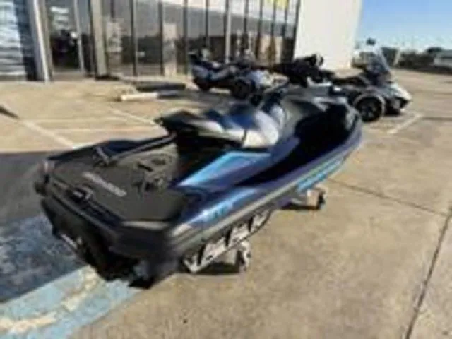 Slide: The Image of 2026 Sea-Doo GTX 230 jet ski in parking lot, black and blue design. - 7