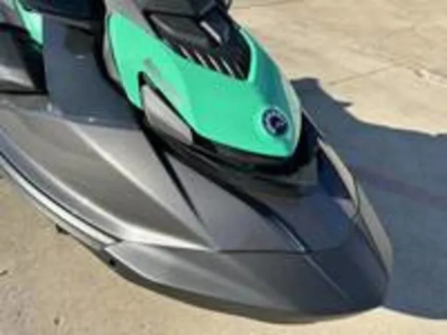 Slide: The Image of 2026 Sea-Doo GTI SE 130 jet ski in green and gray. - 12