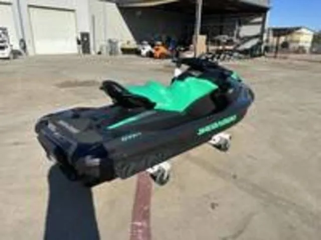 Slide: The Image of 2026 Sea-Doo GTI SE 130 jet ski in a parking lot. - 3