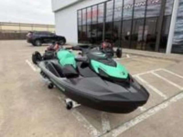 Slide: The Image of 2026 Sea-Doo GTI SE 170 jet ski parked outside a building. - 3