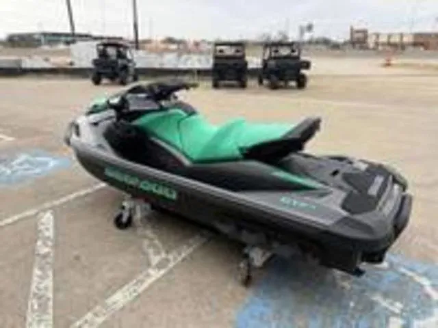 Slide: The Image of 2026 Sea-Doo GTI SE 170 jet ski parked in a lot. - 8
