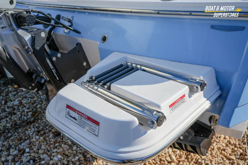 Slide: The Image of 2025 Blackfin 242 HB boat ladder detail with safety warning label. - 11