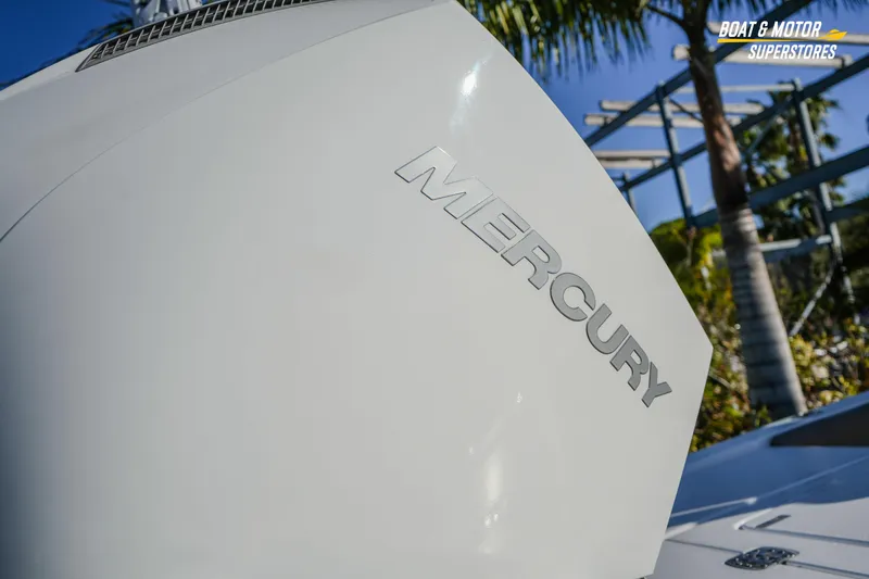 Slide: The Image of Close-up of Mercury engine on 2025 Blackfin 242 HB boat, outdoors. - 13