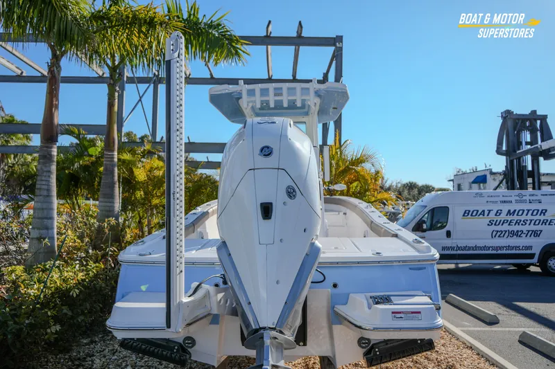 Slide: The Image of 2025 Blackfin 242 HB boat displayed at Boat & Motor Superstores, surrounded by palm trees. - 15