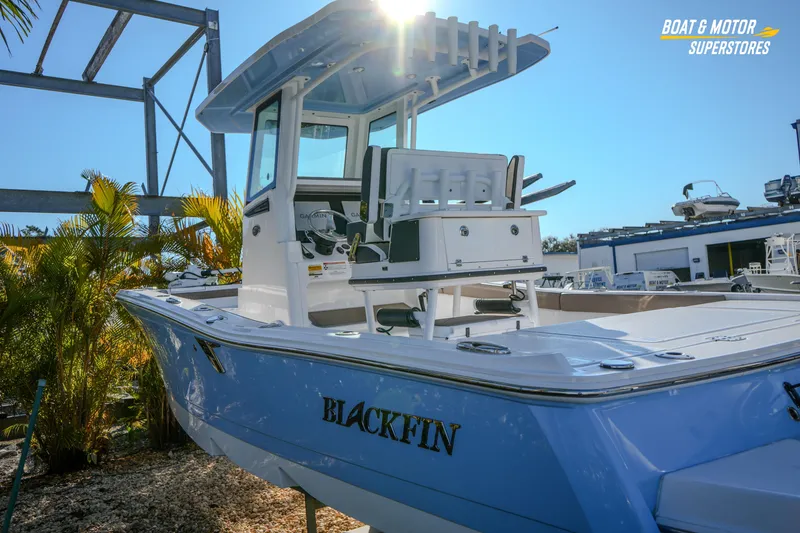 Slide: The Image of 2025 Blackfin 242 HB boat displayed outdoors under clear blue sky. - 17
