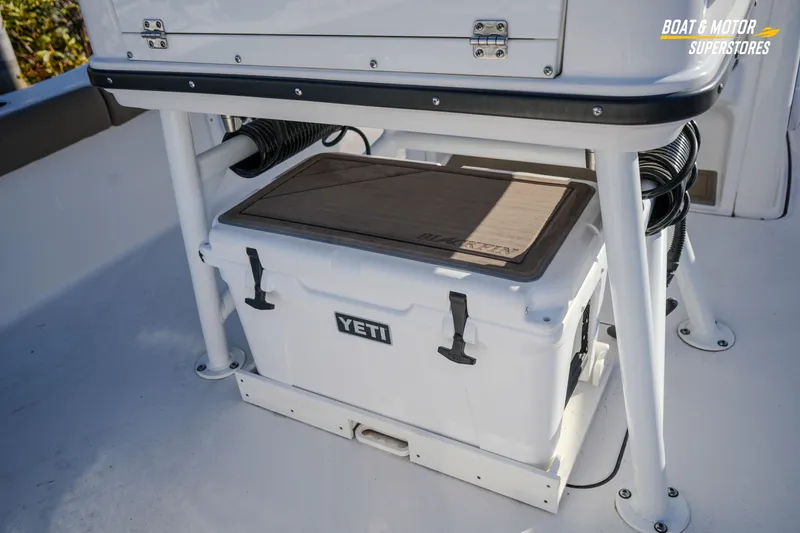 Slide: The Image of 2025 Blackfin 242 HB boat with Yeti cooler under seat. - 22