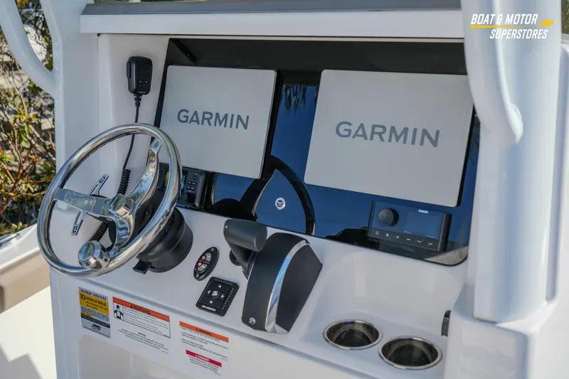 Slide: The Image of 2025 Blackfin 242 HB boat dashboard with Garmin navigation displays. - 26