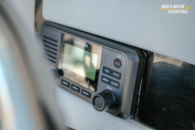 Slide: The Image of Garmin marine radio on 2025 Blackfin 242 HB boat dashboard. - 29