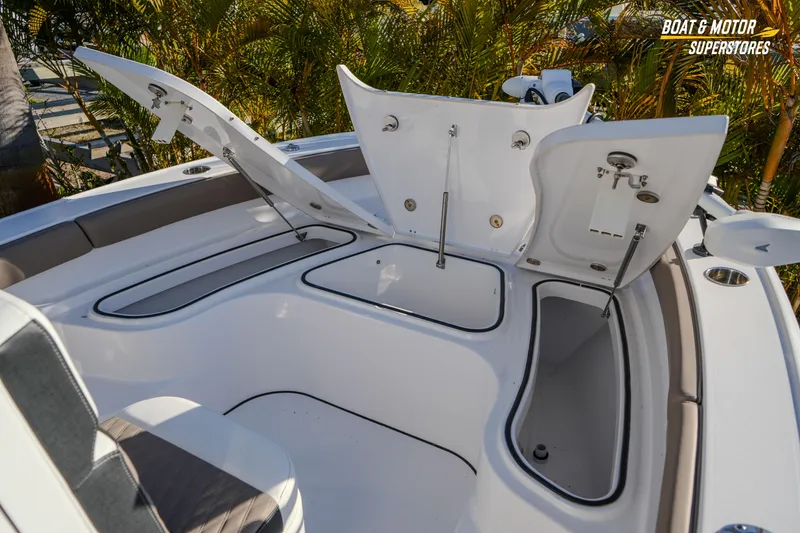 Slide: The Image of 2025 Blackfin 242 HB boat with open storage compartments and seating area. - 33