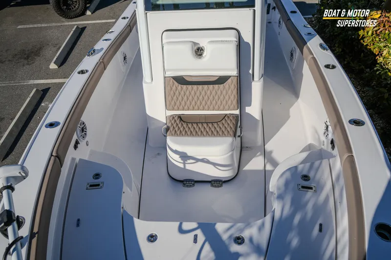 Slide: The Image of 2025 Blackfin 242 HB boat interior with cushioned seating and modern design. - 37