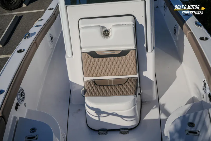 Slide: The Image of 2025 Blackfin 242 HB boat interior with cushioned seating and modern design. - 39