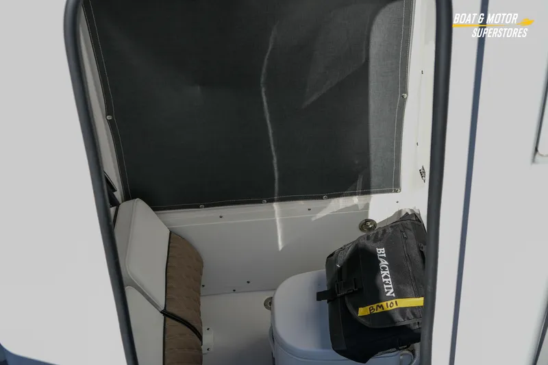 Slide: The Image of Interior of 2025 Blackfin 242 HB boat with seating and storage bag. - 41