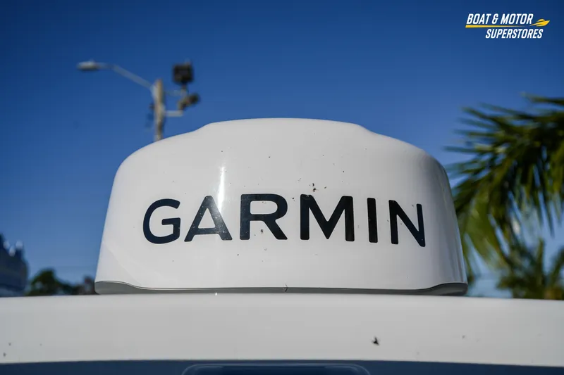 Slide: The Image of Garmin device on 2025 Blackfin 242 HB boat under clear blue sky. - 44