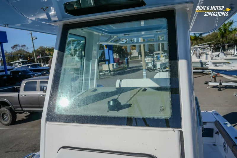 Slide: The Image of 2025 Blackfin 242 HB boat windshield at dealership, showcasing sleek design and modern features. - 45