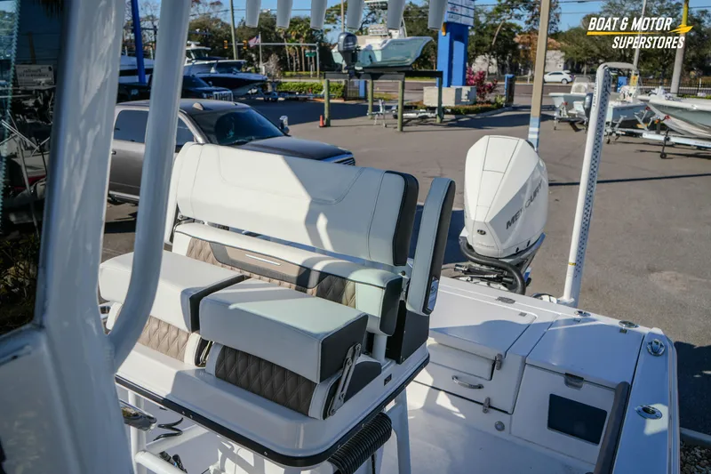 Slide: The Image of 2025 Blackfin 242 HB boat interior with seating and Mercury outboard motor. - 46