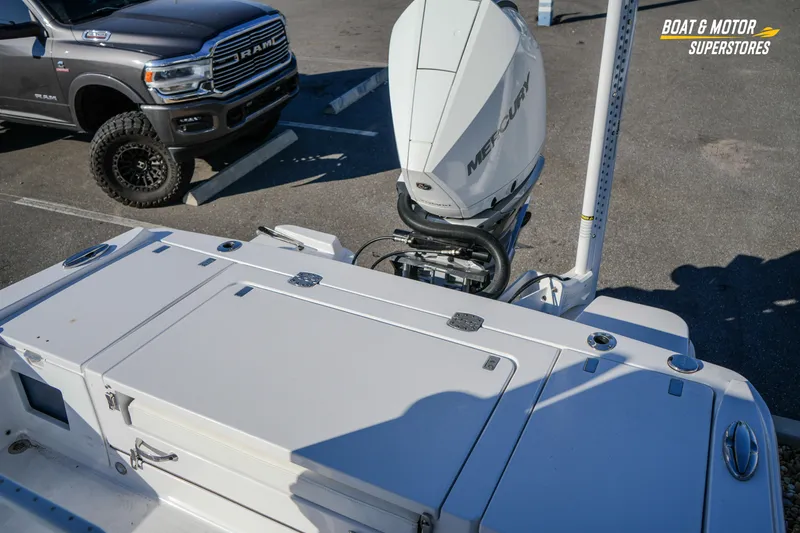 Slide: The Image of 2025 Blackfin 242 HB boat with Mercury engine in parking lot. - 49