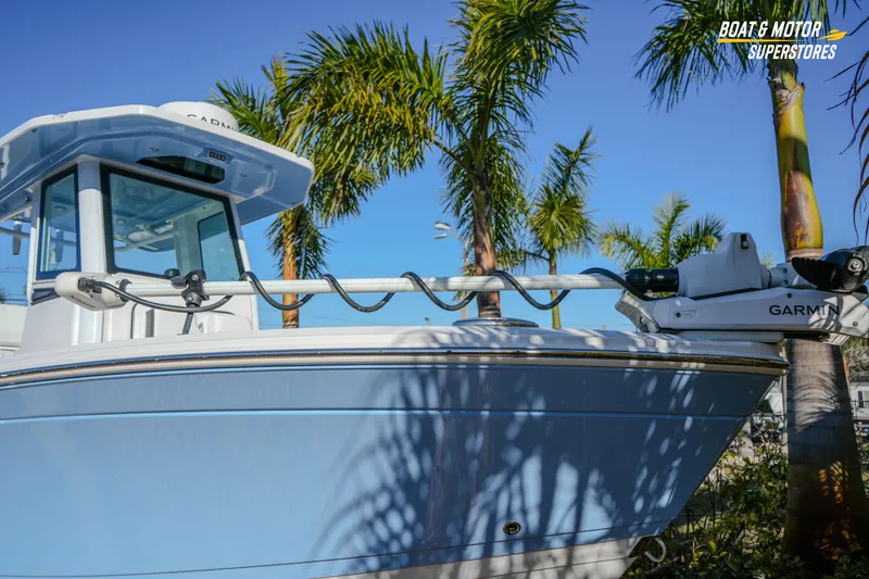 Slide: The Image of 2025 Blackfin 242 HB boat with Garmin equipment, surrounded by palm trees. - 5