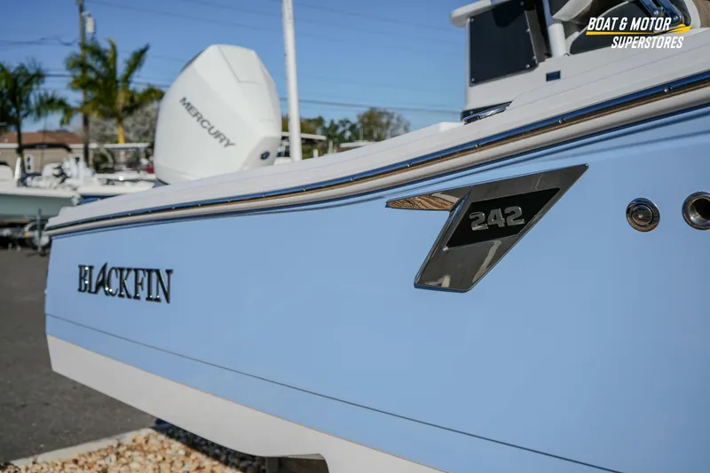 Slide: The Image of 2025 Blackfin 242 HB boat with Mercury engine, displayed at Boat & Motor Superstores. - 7