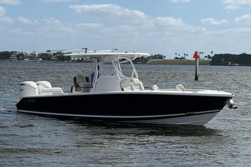 The Image of 2026 Jupiter 32 boat on water, sleek design, dual engines, clear sky background. - 0