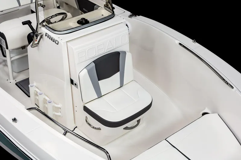 Slide: The Image of Manufacturer Provided Image: 2025 Robalo R180 Center Console boat interior with seating and console details. - 5