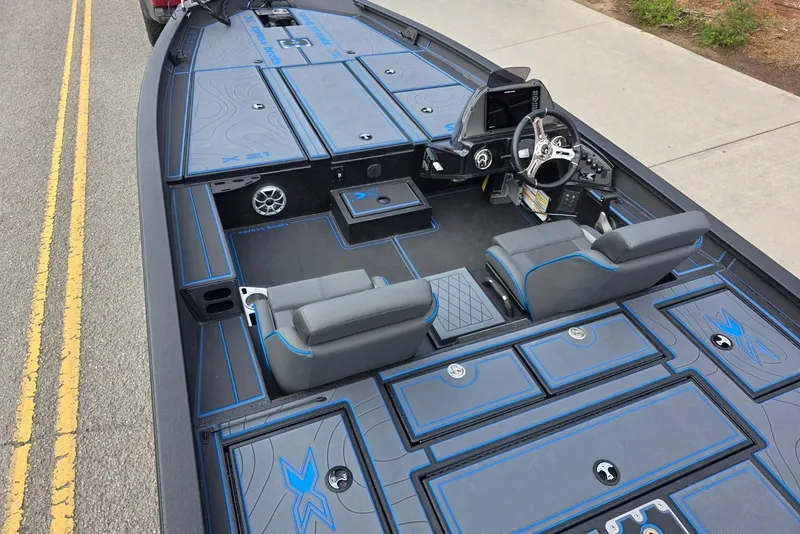 Slide: The Image of 2026 Xpress X21 Pro boat interior with sleek seating and advanced dashboard controls. - 11