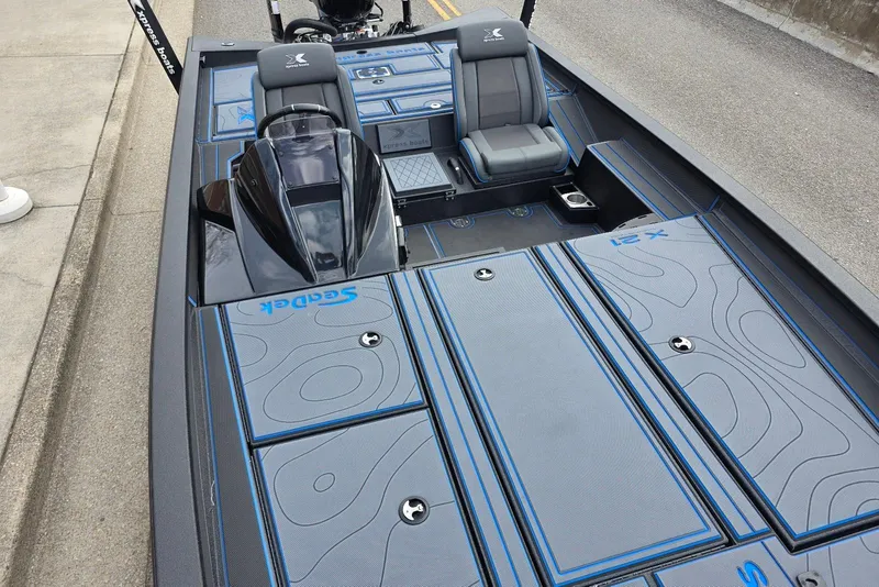 Slide: The Image of 2026 Xpress X21 Pro boat interior with sleek design and modern seating. - 13