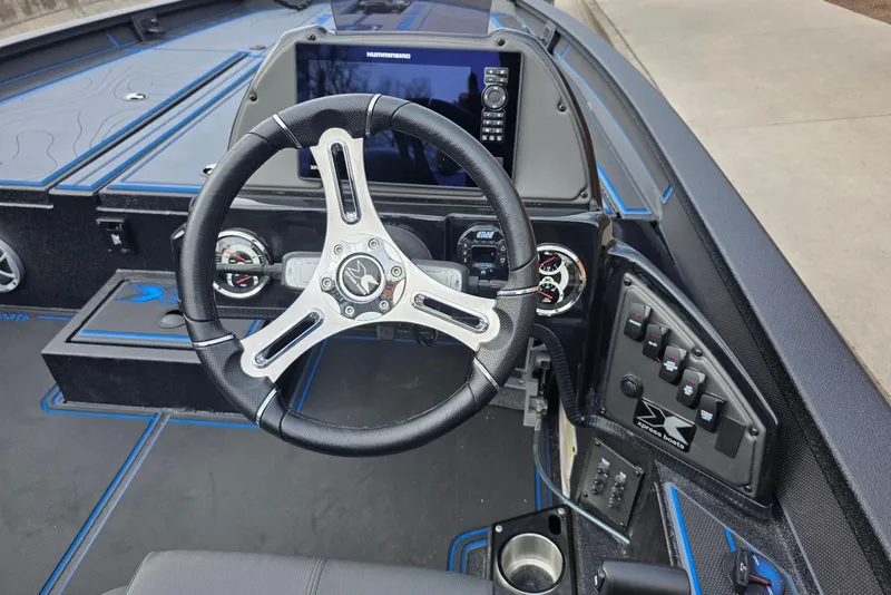 Slide: The Image of Steering console of 2026 Xpress X21 Pro boat with advanced controls and display. - 17