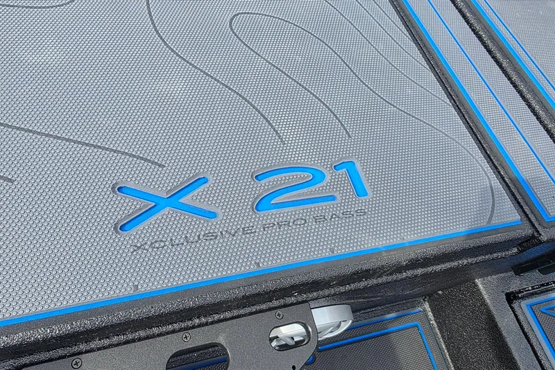 Slide: The Image of Xpress X21 Pro 2026 boat deck with textured surface and blue accents. - 23