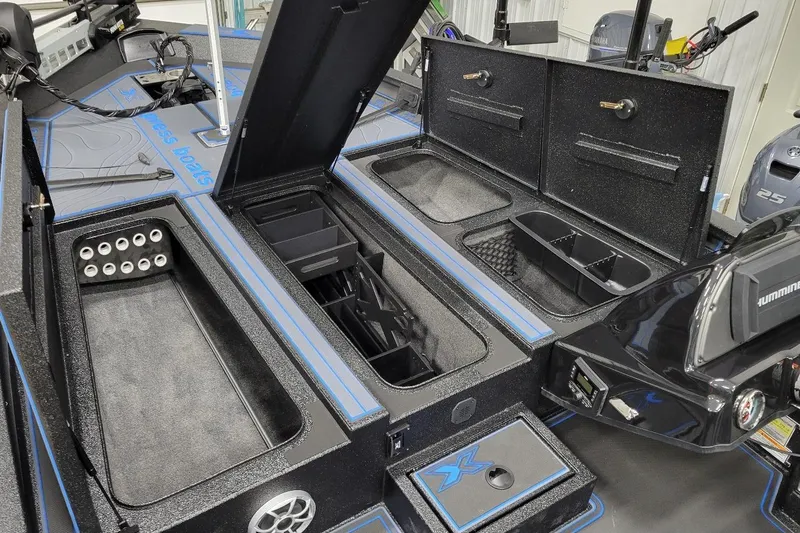 Slide: The Image of 2026 Xpress X21 Pro boat interior with storage compartments and fishing rod holders. - 3