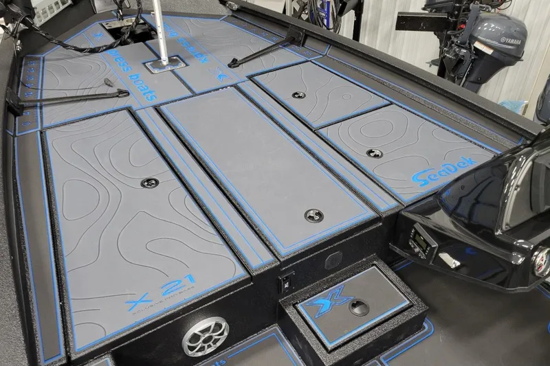 Slide: The Image of 2026 Xpress X21 Pro boat deck with SeaDek flooring and storage compartments. - 4