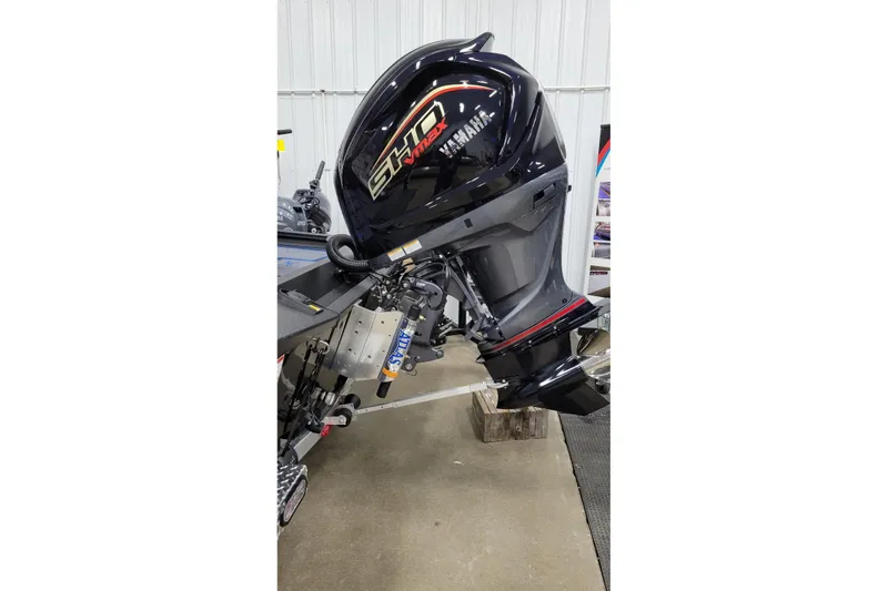 Slide: The Image of 2026 Xpress X21 Pro boat with Yamaha outboard motor in a garage setting. - 6