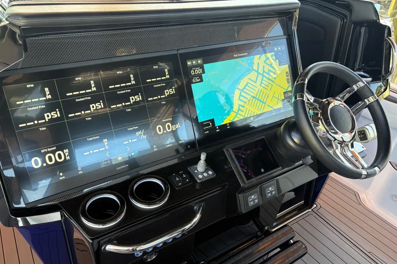 Slide: The Image of 2024 Nor-Tech 400 Supersport dashboard with dual screens and modern steering wheel. - 16
