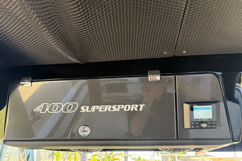 Slide: The Image of 2024 Nor-Tech 400 Supersport dashboard with carbon fiber finish and JL Audio system. - 18