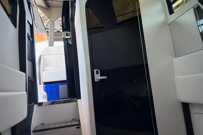 Slide: The Image of Interior view of 2024 Nor-Tech 400 Supersport boat, featuring sleek design and modern seating. - 26