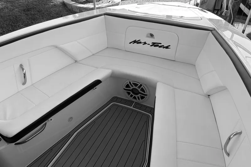 Slide: The Image of 2024 Nor-Tech 400 Supersport boat interior with white seating and sleek design. - 4
