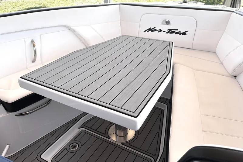 Slide: The Image of 2024 Nor-Tech 400 Supersport interior with sleek seating and stylish table design. - 5