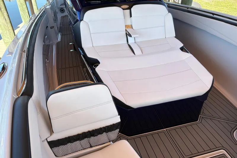Slide: The Image of Luxurious seating on 2024 Nor-Tech 400 Supersport boat with sleek white upholstery. - 6