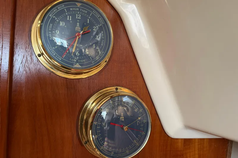 Slide: The Image of Nautical instruments on 1979 O'Day 37 sailboat, featuring tide and barometer gauges. - 20
