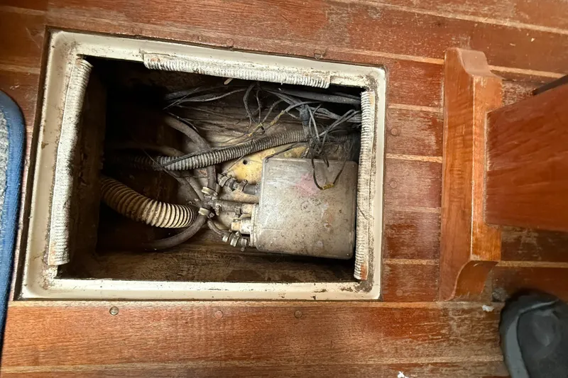 Slide: The Image of Electrical compartment on 1979 O'Day 37 sailboat with exposed wiring and components. - 21