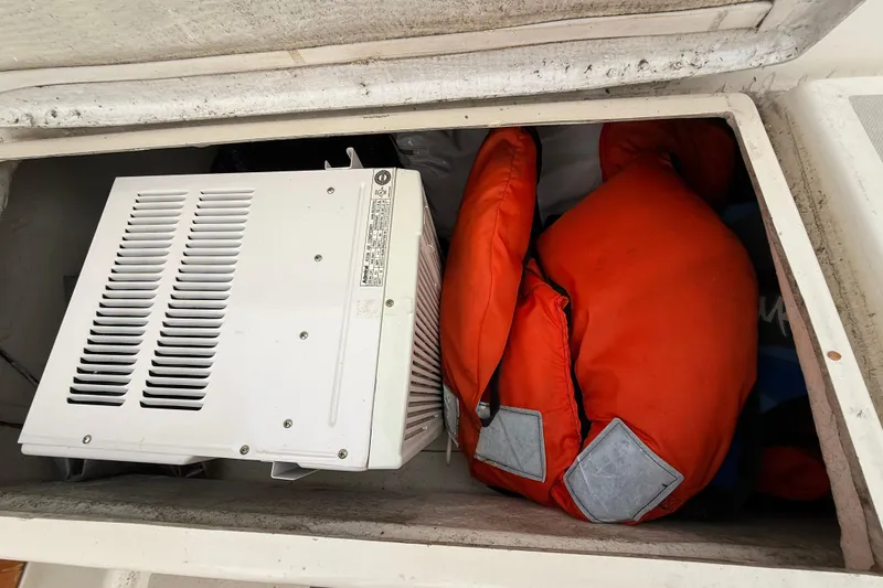 Slide: The Image of Storage compartment on 1979 O'Day 37 with life jackets and equipment. - 24