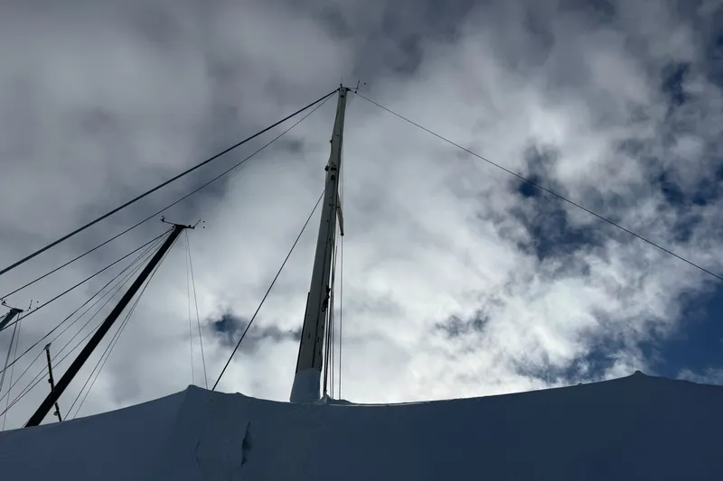 Slide: The Image of Mast of 1979 O'Day 37 sailboat against cloudy sky. - 3