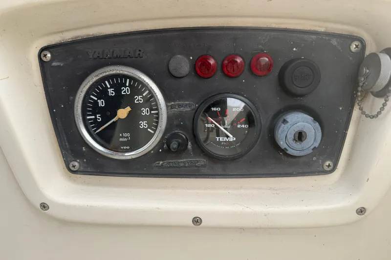 Slide: The Image of Instrument panel of a 1979 O'Day 37 sailboat with gauges and controls. - 30