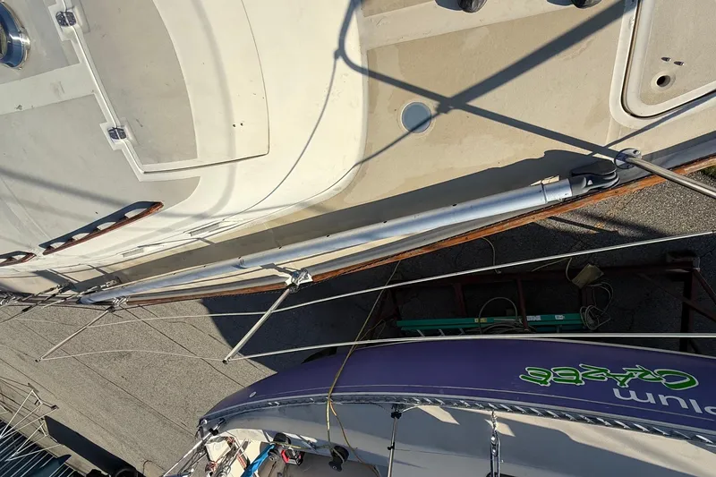 Slide: The Image of Aerial view of a 1979 O'Day 37 sailboat docked, showcasing deck and rigging. - 32