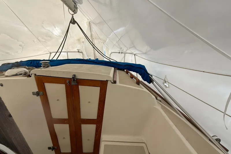 Slide: The Image of Interior view of a 1979 O'Day 37 sailboat with wooden cabinetry and rigging. - 5