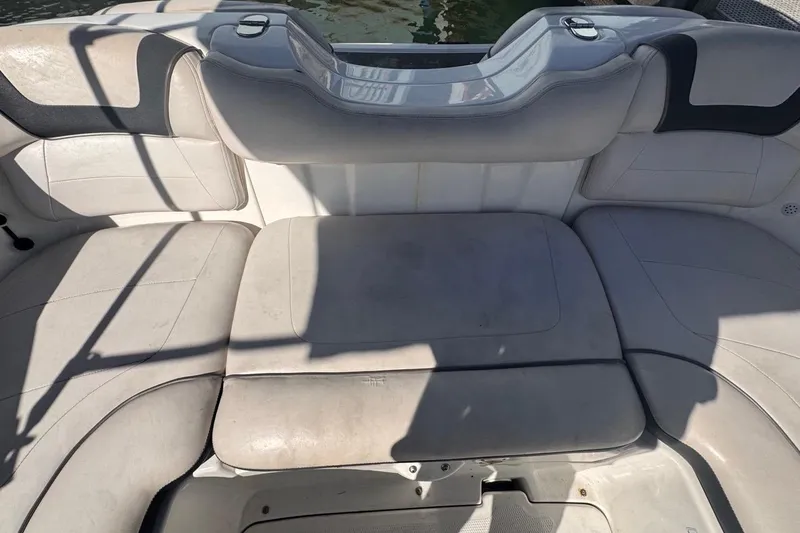 Slide: The Image of 2012 Yamaha Boats SX190 interior seating with light gray upholstery. - 17