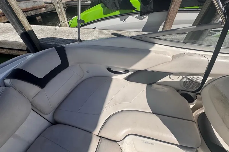 Slide: The Image of 2012 Yamaha Boats SX190 interior with white seating and cup holders. - 18