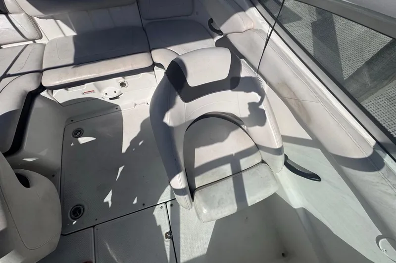 Slide: The Image of Interior seating of a 2012 Yamaha Boats SX190, featuring white cushioned seats. - 19