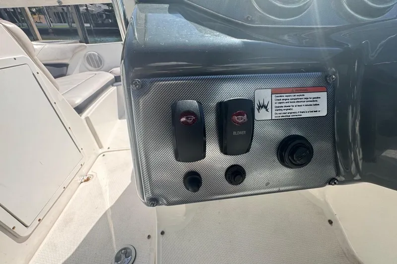 Slide: The Image of Control panel of a 2012 Yamaha Boats SX190, featuring blower switches and warning label. - 22